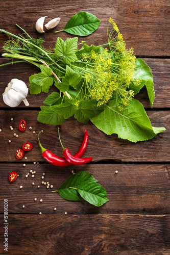 Herbs and spices on wooden culinary background, ingredients for cooking