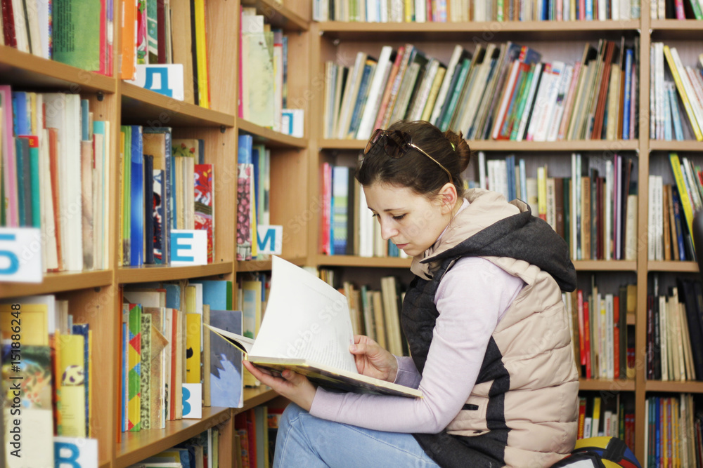 woman reading book at library woman reading book at library