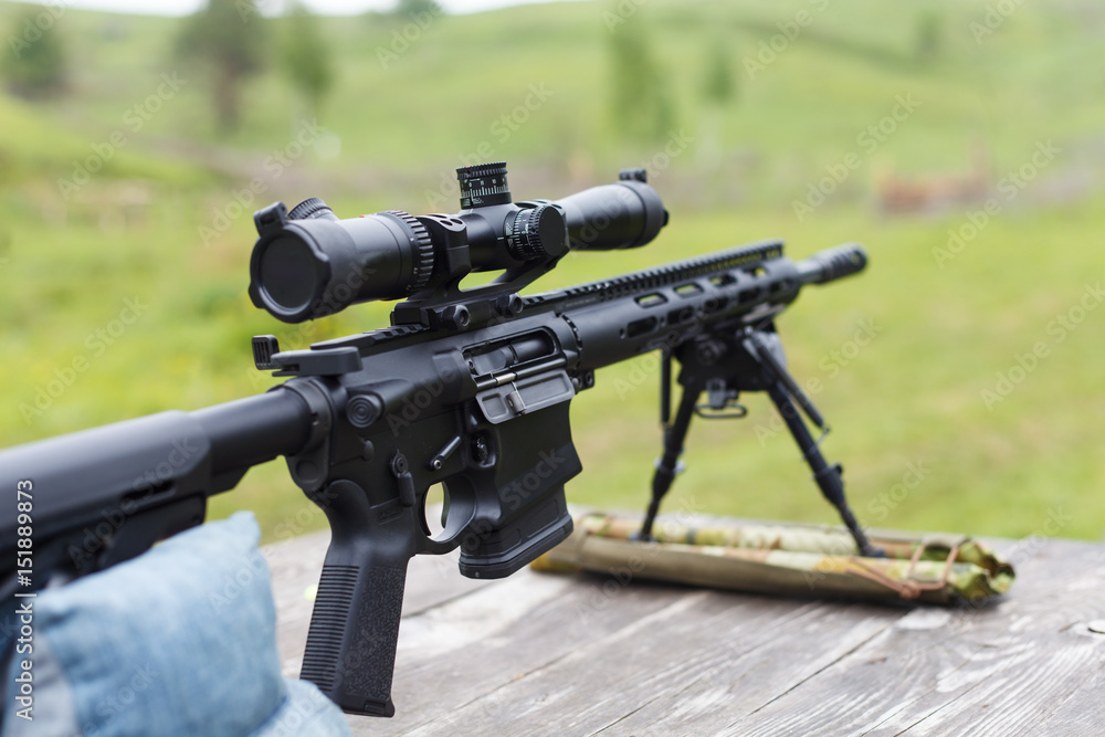 Sniper rifle. Horizontally. On the table in the forest. Sniper rifle. Horizontally. On the table in the forest.