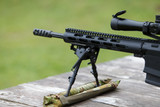 Sniper rifle. Horizontally. On the table in the forest.