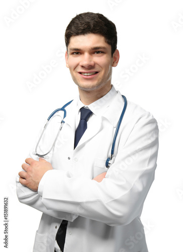 Handsome young doctor on white background © Africa Studio