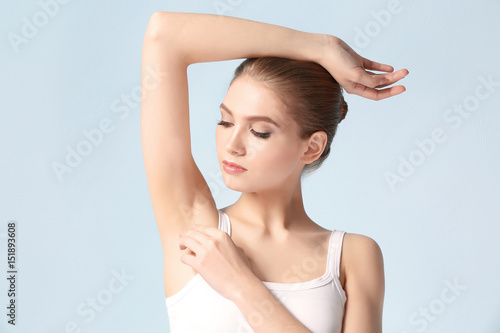 Beautiful young woman on color background. Epilation concept photo