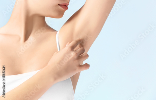 Beautiful young woman on color background  closeup. Epilation concept