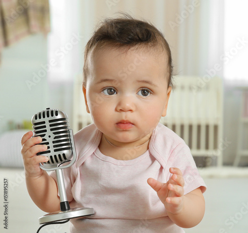 Cute little baby with micro...