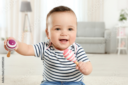 Cute little baby with rattl...