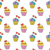 Seamless pattern with cupcakes on the white background.