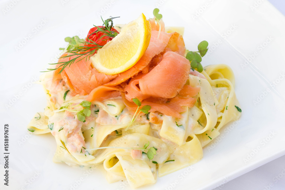 Salmon with pasta served in a restaurant