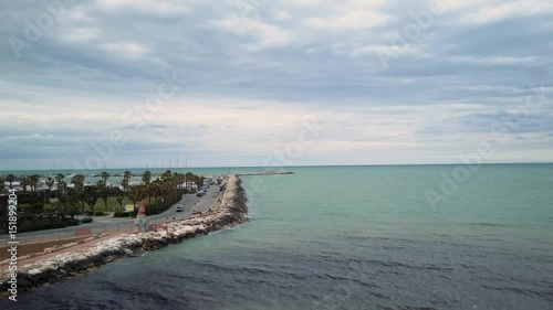 Wallpaper Mural A day at the beach, the weather was overcast and dark, in this aerial footage by drone is visibile a seascape and rocks during a overcast and moody day Torontodigital.ca