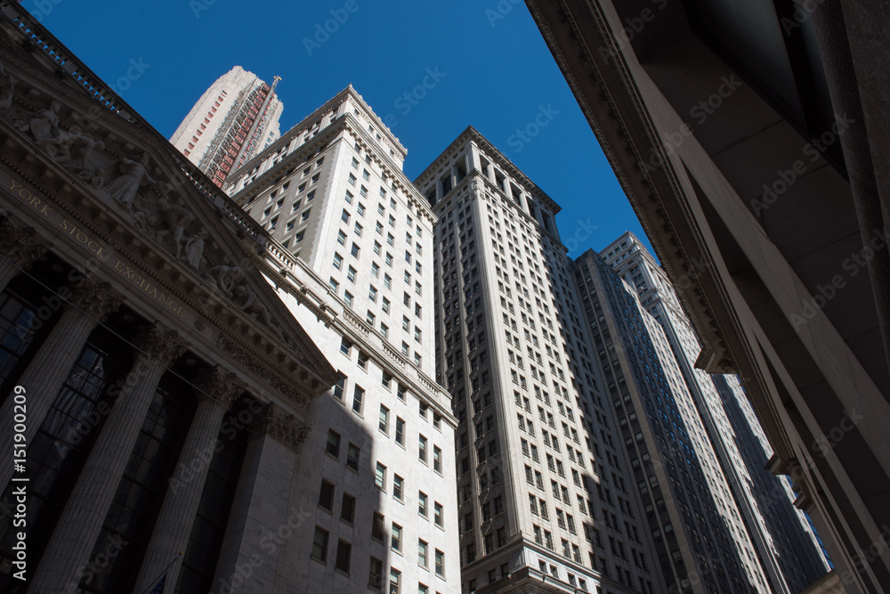 Old New York City architecture in downtown Manhattan in the shadows of the early morning sun