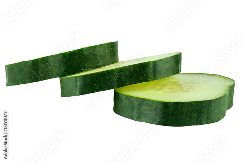 Isolated pieces of cucumber on ehite background. photo