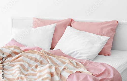 Cozy modern bed with soft pillows