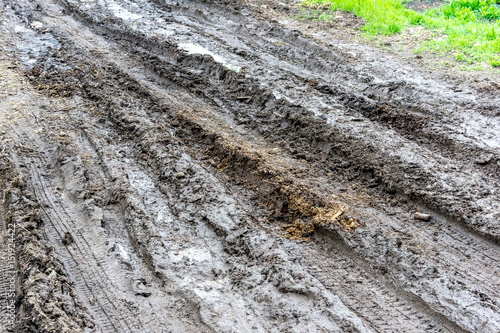 Muddy, wet road with tire tracks © bearok