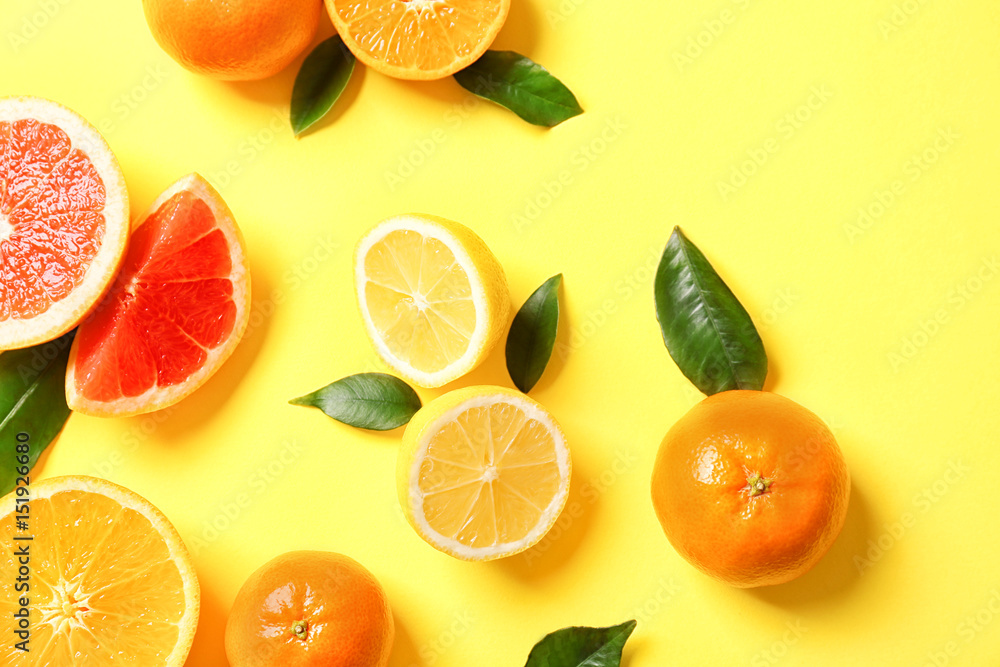 Juicy composition of tropical fruits on yellow background Juicy composition of tropical fruits on yellow background