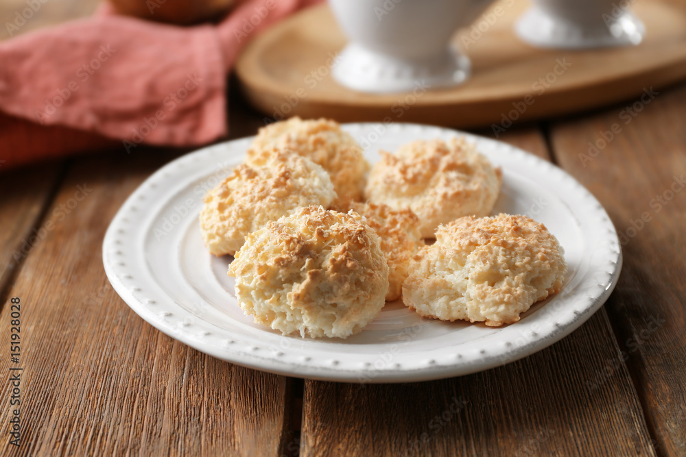 Plate with delicious coconut macaroons on table Plate with delicious coconut macaroons on table