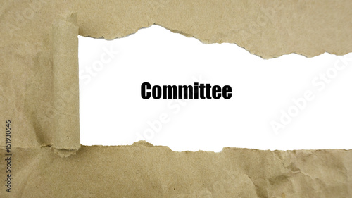 Torn brown paper on white surface with 