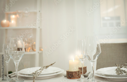 Table setting with spring decoration and candles © Africa Studio