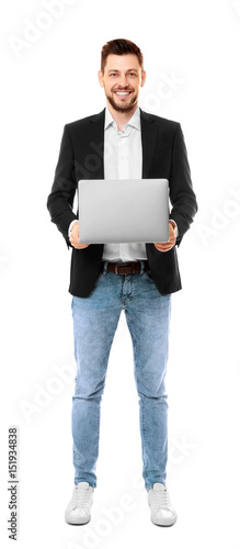 Handsome young man with lap...