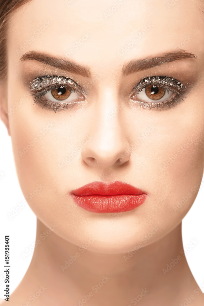 Beautiful young woman with holiday make up on white background Beautiful young woman with holiday make up on white background