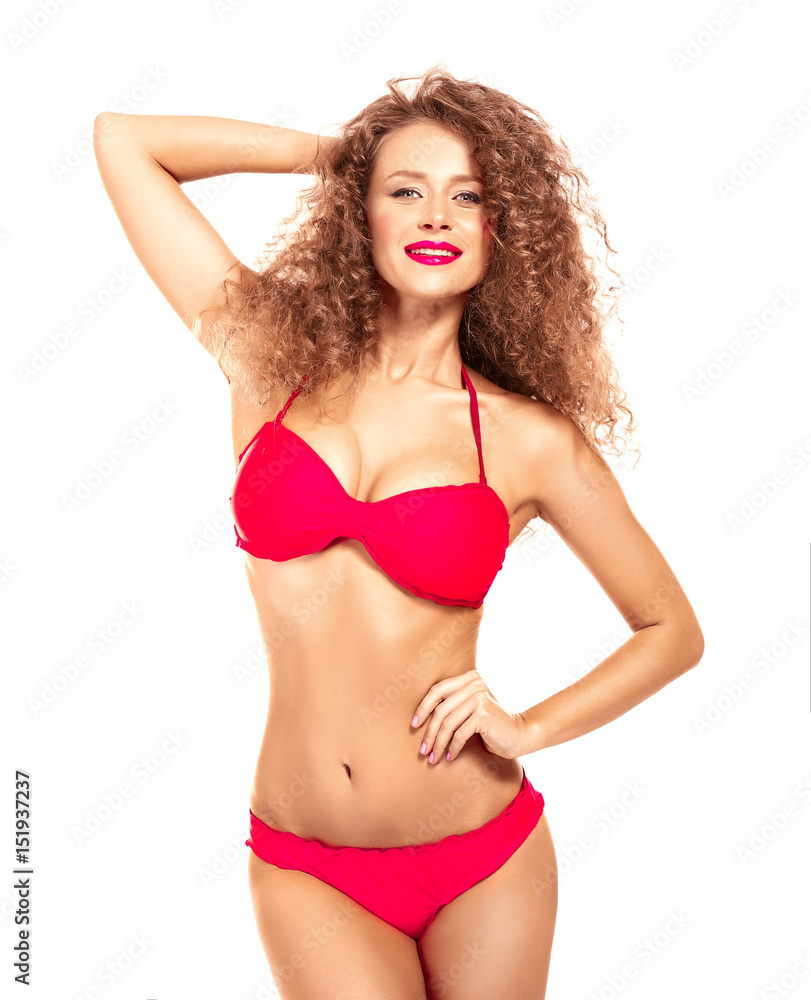Obraz premium Beautiful young woman in bikini on white background