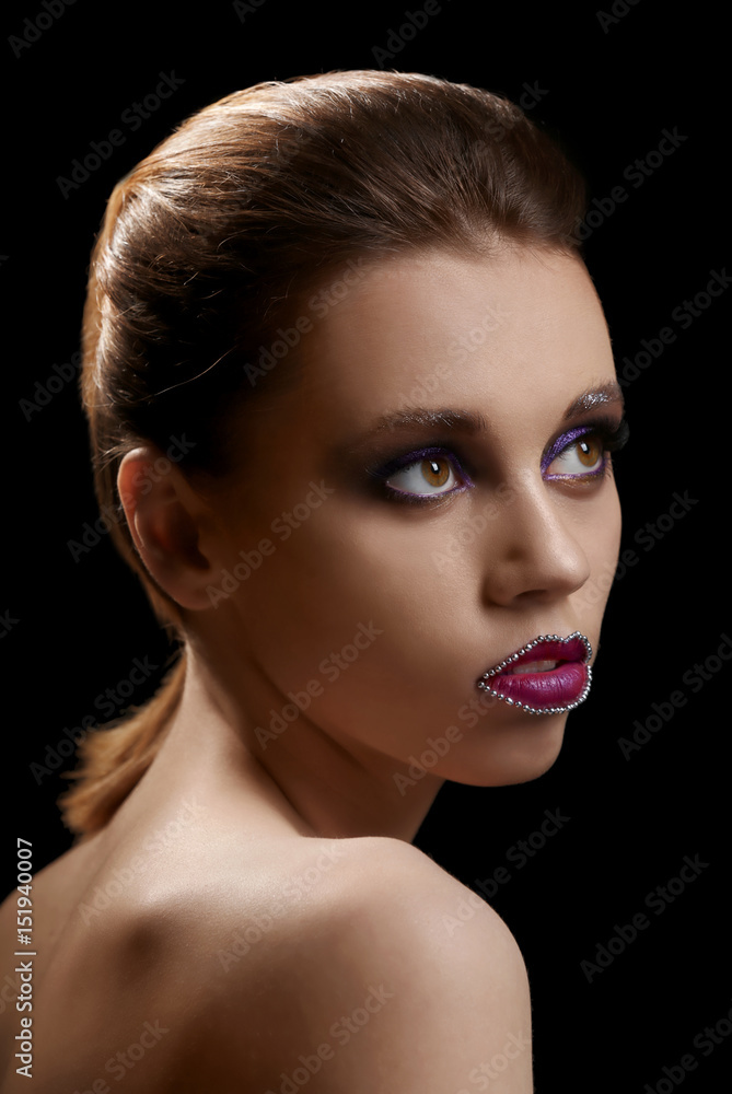 Beautiful young woman with creative makeup on dark background Beautiful young woman with creative makeup on dark background