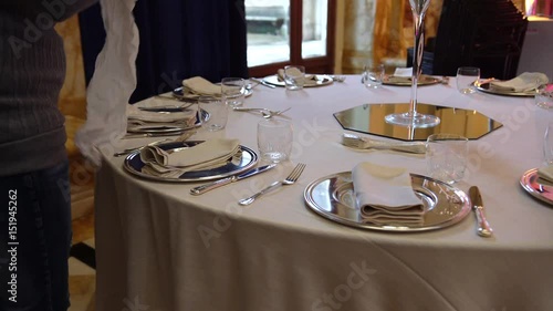 Wedding catering preparation, a waiter preparing a beautiful table set for a wedding in Italy, 4K.