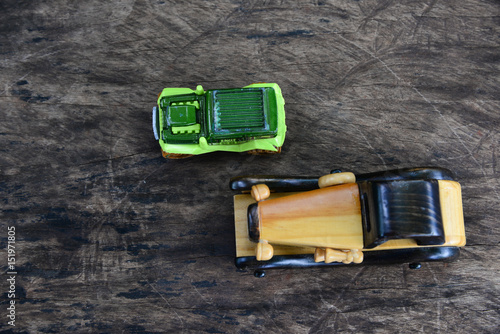 Toy car on wood texture.