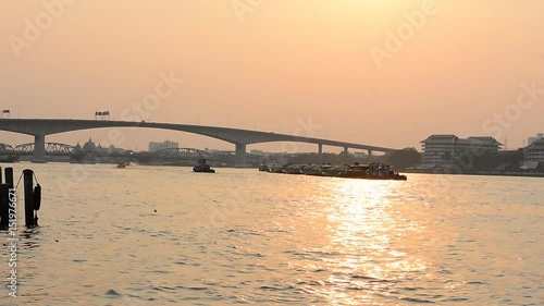 Thai transportation, boat on the Chaophaya river under the beautiful at sunset in Bangkok, THAILAND, 28 Febuary 2017 photo