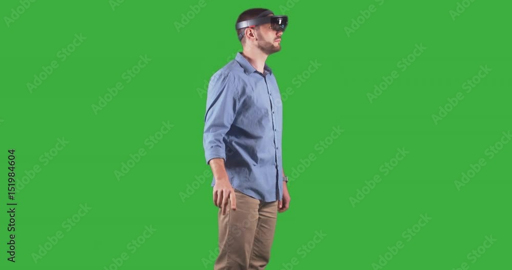 Stockvideon Young adult Caucasian male using holographic augmented