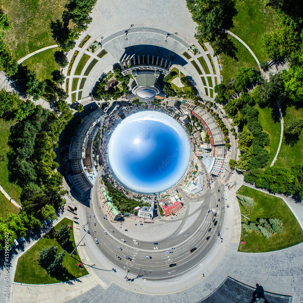 Aerial city view with crossroads, roads, houses, buildings, parks and parking lots. Copter drone helicopter shot. Panoramic wide angle image. Aerial city view with crossroads, roads, houses, buildings, parks and parking lots. Copter drone helicopter shot. Panoramic wide angle image.