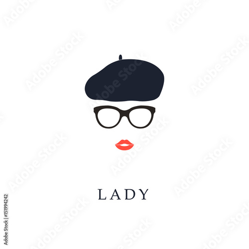 Beautiful trendy French woman wearing glasses and beret. Fashion girl portrait.