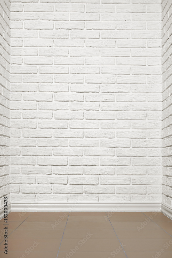 Fototapeta premium white brick wall with tiled floor, abstract background photo