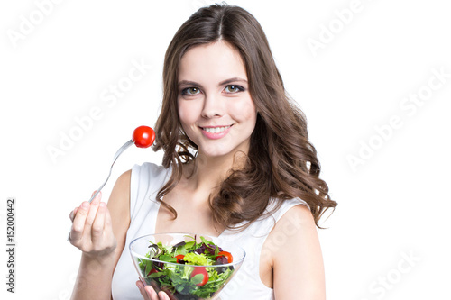 Young woman with healthy salad. Isolated on white.