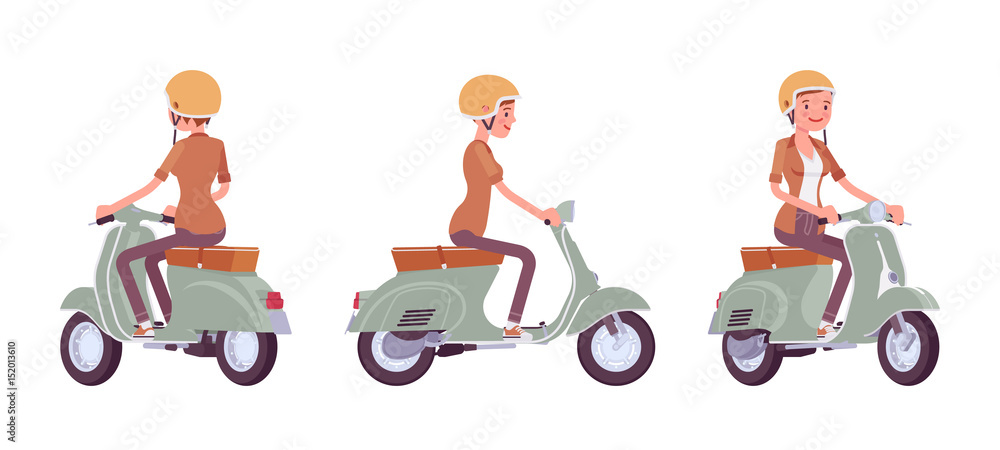 Fototapeta premium Young woman riding a scooter