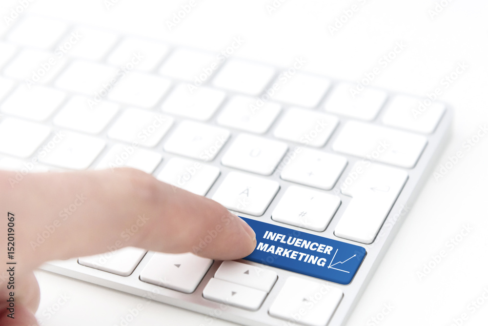 finger pressing a blue key labeled INFLUENCER MARKETING with chart symbol on a computer keyboard concept for success finger pressing a blue key labeled INFLUENCER MARKETING with chart symbol on a computer keyboard concept for success