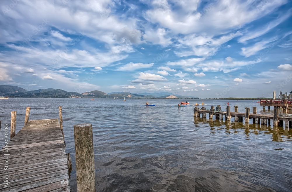 Wood pier in Torre del Lago Puccini, Pisa, Tuscany, Italy