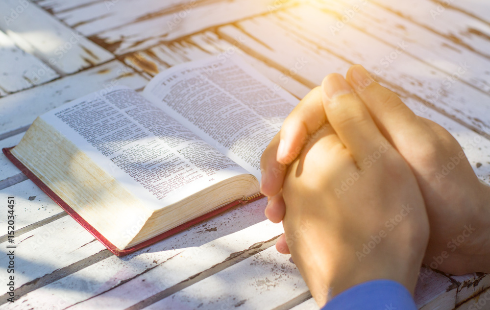 Naklejka premium Man reading from the holy bible, close up