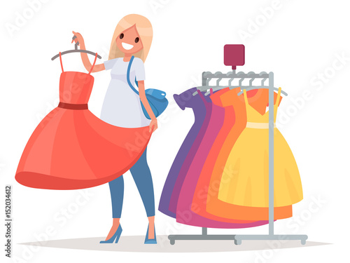 Women's shopping. The girl is trying on a new dress in the store