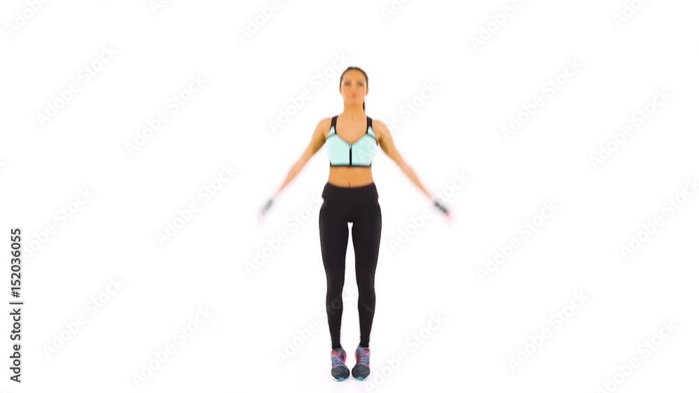Young attractive female fitness model doing exercises isolated on white background Young attractive female fitness model doing exercises isolated on white background