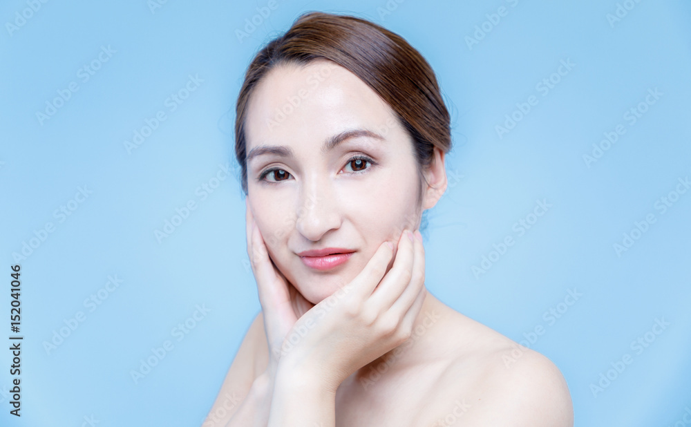beautiful woman massaging her face. lymphatic massage. beautiful woman massaging her face. lymphatic massage.
