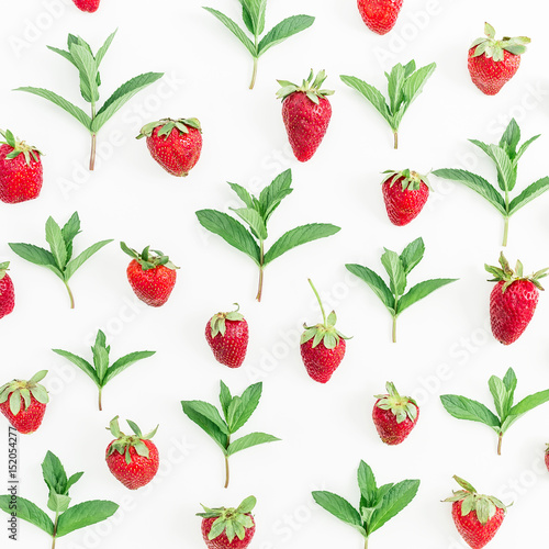 Colourful pattern made of strawberries and mint leaves on white background. Background of berries. Flat lay, top view.
