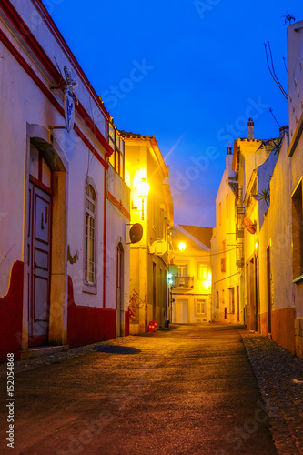 old colorful european city street at night