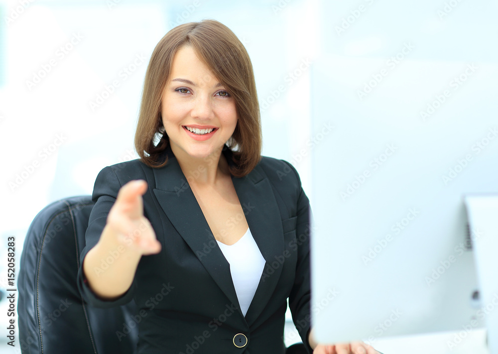 Happy smiling businesswoman in suit giving hand for handshake.