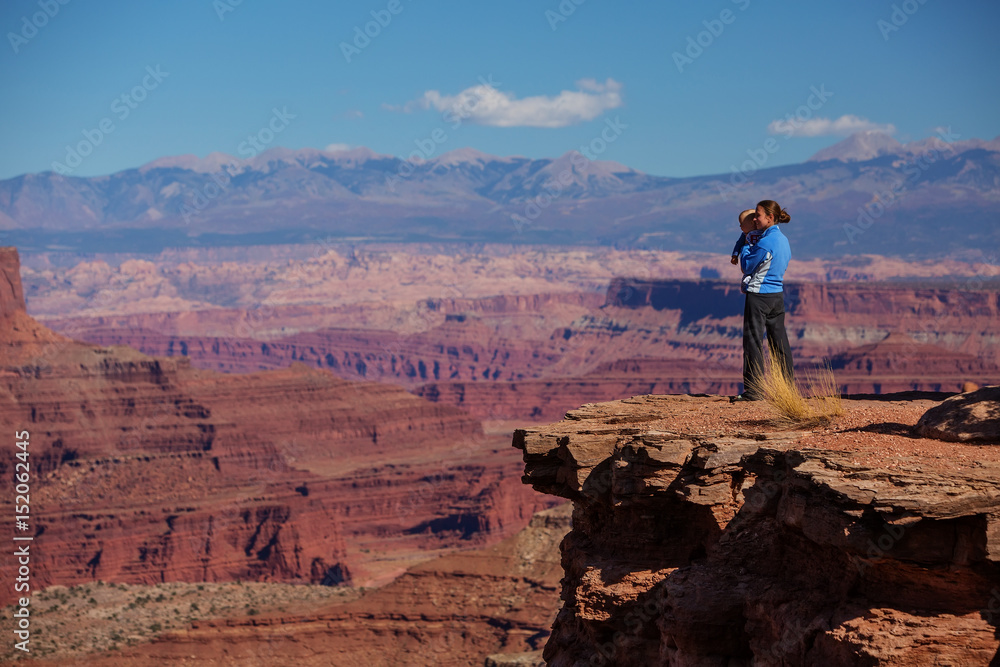 A mother and her baby son visit Canyonlands National park in Utah, USA