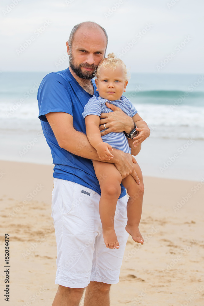 Portrait of a father and his son at the seashore Portrait of a father and his son at the seashore