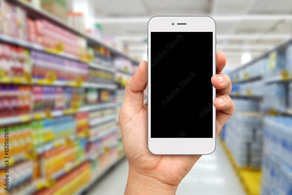 Hand holding White Smartphone for online shopping concept Hand holding White Smartphone for online shopping concept