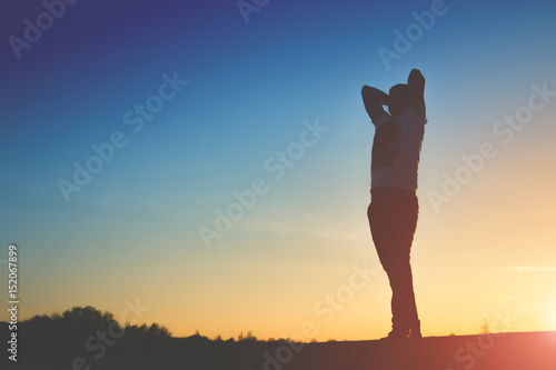 man silhouette on sunset background