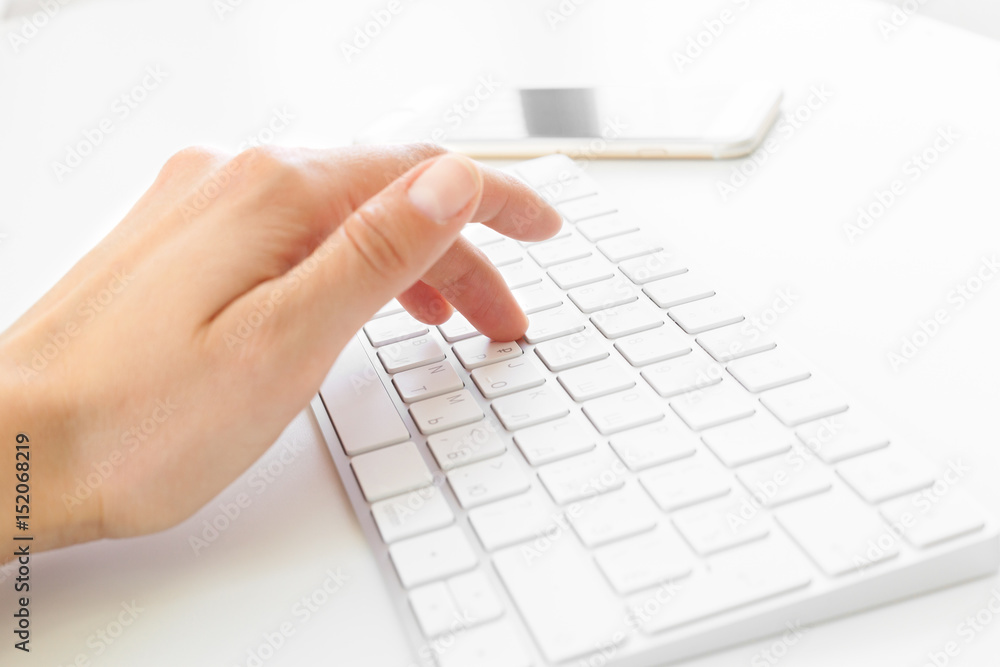 Woman's hands using keyboard at the office Woman's hands using keyboard at the office
