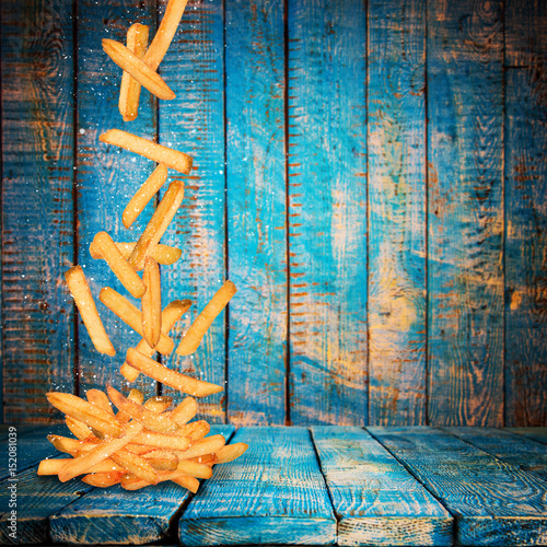 French fries in freeze motion. photo