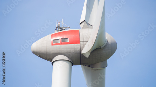 Close up of  wind turbine propeller blades in the blue sky  © Riko Best