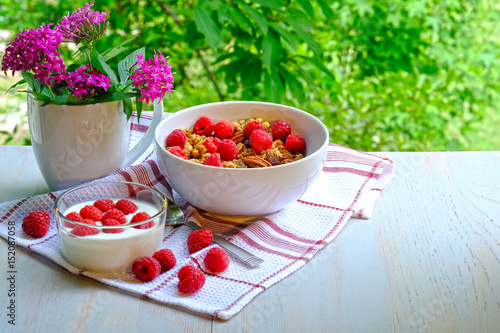 Breakfast with raspberries, yogurt and muesli